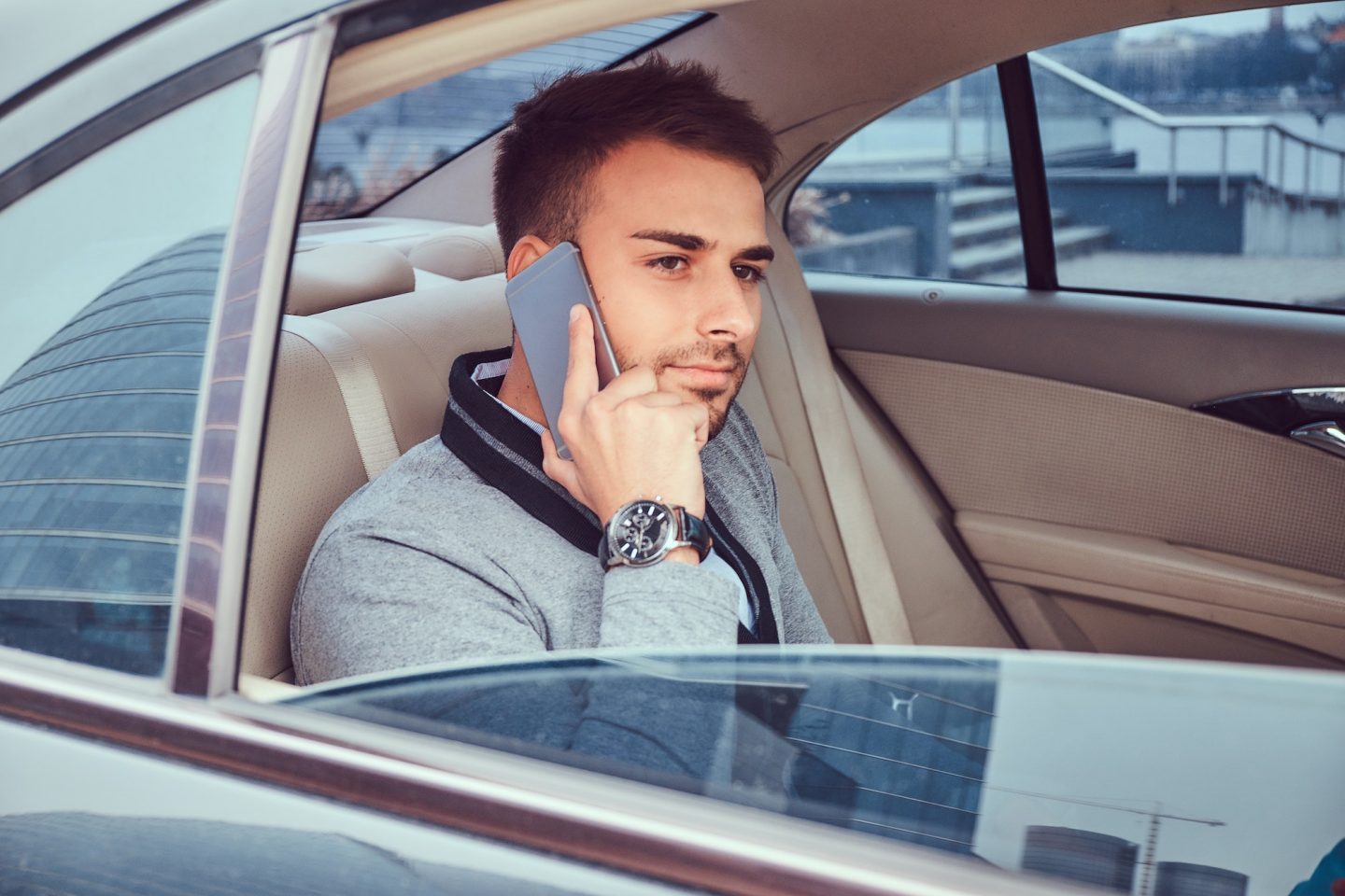 A handsome businessman in luxury car